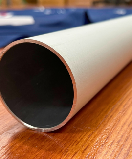 Close-up of a metal pipe on wood surface
