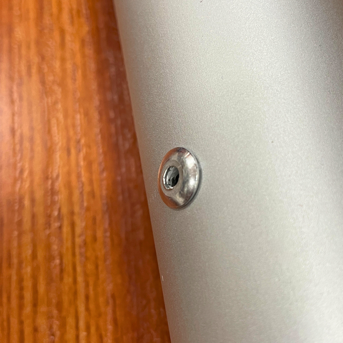 Close-up of screw on metallic surface
