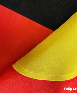Close-up of red, yellow, and black sewn fabric