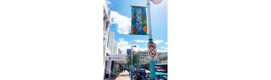 Colorful street banners on a sunny urban day