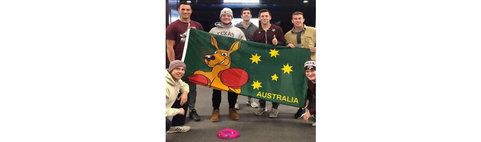 Group holding Australian flag with boxing kangaroo