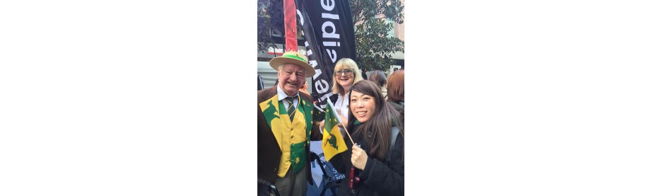 People celebrating with Australian flags outdoors