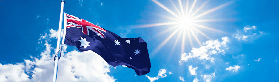 Australian flag waving under sunny sky