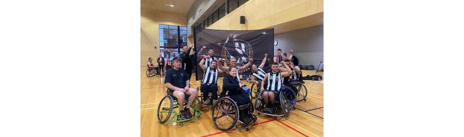Wheelchair basketball team celebrating in gym