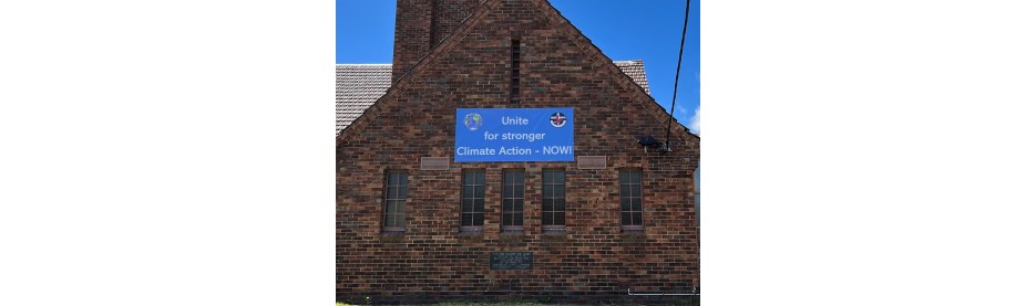 Brick church displays climate action banner